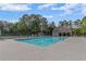 A sparkling community pool with lounge chairs and a covered pavilion area for shade at 1440 Water View Ln, Suwanee, GA 30024