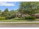 Inviting home showcasing professional landscaping, mature trees, and a well-maintained front lawn at 1440 Water View Ln, Suwanee, GA 30024