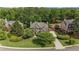 Beautiful home with lush landscaping, a long driveway, and mature trees creating a private setting at 1440 Water View Ln, Suwanee, GA 30024