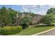 Beautiful home with manicured landscaping, mature trees, and a well-kept lawn in a desirable neighborhood at 1440 Water View Ln, Suwanee, GA 30024