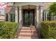 Inviting front door with brick steps and manicured landscaping at 1440 Water View Ln, Suwanee, GA 30024