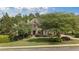 Charming brick home with a well-manicured lawn and mature trees, offering great curb appeal at 1440 Water View Ln, Suwanee, GA 30024