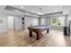 Spacious game room featuring a pool table, recessed lighting, and luxury vinyl flooring at 1440 Water View Ln, Suwanee, GA 30024