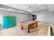 This bright game room features a pool table, ping pong, and piano for multiple entertainment options at 1440 Water View Ln, Suwanee, GA 30024