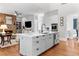 Spacious kitchen with island, stainless steel appliances, and hardwood floors at 1440 Water View Ln, Suwanee, GA 30024