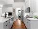 Bright kitchen with stainless steel appliances, marble countertops, and a kitchen island at 1440 Water View Ln, Suwanee, GA 30024
