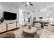 Bright, open-concept living room adjacent to modern kitchen area at 1440 Water View Ln, Suwanee, GA 30024
