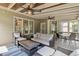 Relax on this comfortable screened porch with ceiling fans and a serene outdoor view at 1440 Water View Ln, Suwanee, GA 30024