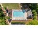 Overhead shot of a clean community swimming pool, surrounded by lounge chairs, playground, and landscaping at 1440 Water View Ln, Suwanee, GA 30024