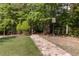 Stone walking trail winding through a wooded area with ample shade and greenery at 1440 Water View Ln, Suwanee, GA 30024