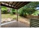 Backyard deck and backyard with a grassy area, wooden fence and mature trees at 1627 Rex Dr, Marietta, GA 30066