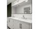 Double sink bathroom vanity with quartz counters, stylish faucets, and large mirror at 1627 Rex Dr, Marietta, GA 30066