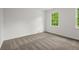 Bedroom featuring neutral walls, carpet, and a window providing natural light at 1627 Rex Dr, Marietta, GA 30066