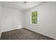 Bedroom with neutral walls, carpet and a window providing natural light at 1627 Rex Dr, Marietta, GA 30066