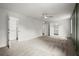 Large bedroom with carpet, white walls, ceiling fan and view to main bathroom at 1627 Rex Dr, Marietta, GA 30066