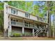Charming two-story home with a covered front porch and well-maintained landscaping at 1627 Rex Dr, Marietta, GA 30066