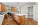 Modern kitchen features wood cabinets, a large island, white countertops, stainless steel appliances, and hardwood floors at 1627 Rex Dr, Marietta, GA 30066