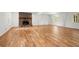 Open living area featuring hardwood floors, stone fireplace, and large windows, filled with natural light and modern decor at 1627 Rex Dr, Marietta, GA 30066
