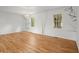 Bright living area with hardwood floors, white walls, decorative wall art, modern lighting, and filled with natural light at 1627 Rex Dr, Marietta, GA 30066