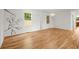 Modern living area boasting hardwood floors, decorative wall accents, a stylish light fixture, and bright natural light at 1627 Rex Dr, Marietta, GA 30066
