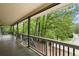 Inviting covered porch featuring gray floors, white railings and black metal spindles offering views of the street at 1627 Rex Dr, Marietta, GA 30066