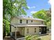 Rear view of a lovely home featuring a back deck and lush backyard at 1627 Rex Dr, Marietta, GA 30066