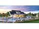 Community pool area with lounge chairs, umbrellas, and lush landscaping at 2505 Kirkwood Dr, Cumming, GA 30041
