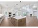 Open kitchen and living area with large island and stainless steel appliances at 2505 Kirkwood Dr, Cumming, GA 30041
