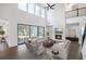 Grand living room with soaring ceilings, fireplace, and large windows at 2505 Kirkwood Dr, Cumming, GA 30041