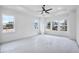 Spacious main bedroom with neutral color palette, tray ceiling, and ample natural light at 2505 Kirkwood Dr, Cumming, GA 30041