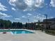 Resort pool with trellis-covered seating, clean design and surrounding greenery at 2505 Kirkwood Dr, Cumming, GA 30041