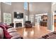 Bright and airy living room features hardwood floors, fireplace, and open access to the kitchen at 300 Bermuda Ct, Dallas, GA 30157