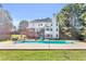 Spacious backyard featuring a large in-ground pool, deck, open patio, green lawn, and privacy fence at 300 Bermuda Ct, Dallas, GA 30157