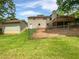 Large, private backyard with a deck and lush green grass perfect for outdoor activities at 527 Tomahawk Trl, Woodstock, GA 30188