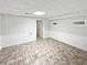 The basement features tile flooring, bright lighting, and access to other areas in the house at 527 Tomahawk Trl, Woodstock, GA 30188