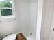 Modern bathroom with new shower and vinyl flooring at 527 Tomahawk Trl, Woodstock, GA 30188
