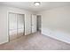 Bright bedroom with carpet, neutral paint and a closet at 527 Tomahawk Trl, Woodstock, GA 30188