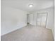 Bedroom with fresh paint, plush carpet, and mirrored closet at 527 Tomahawk Trl, Woodstock, GA 30188