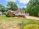 Charming single-Gathering home with a well-maintained lawn and inviting front porch at 527 Tomahawk Trl, Woodstock, GA 30188
