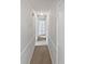 Bright hallway features fresh paint, neutral carpet, and updated lighting at 527 Tomahawk Trl, Woodstock, GA 30188