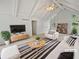 Bright living room featuring vaulted ceilings, modern decor, and neutral colors at 527 Tomahawk Trl, Woodstock, GA 30188