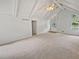 Bright living room featuring vaulted ceilings and neutral colors at 527 Tomahawk Trl, Woodstock, GA 30188