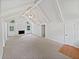Spacious living room with a stone fireplace, vaulted ceilings, and neutral carpet at 527 Tomahawk Trl, Woodstock, GA 30188