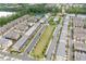 Aerial view of a beautifully designed community with a pool, tennis courts, and lush green spaces at 10200 Windalier Way, Roswell, GA 30076