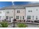 Contemporary townhomes with private balconies, garage access, and modern architectural design at 10200 Windalier Way, Roswell, GA 30076