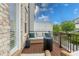 Cozy back porch featuring a comfortable seating area and relaxing outdoor space with a grill at 10200 Windalier Way, Roswell, GA 30076