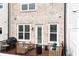 Charming back porch with seating, grill, perfect for enjoying outdoor relaxation and barbecues at 10200 Windalier Way, Roswell, GA 30076