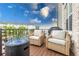 Inviting back porch with comfortable seating, perfect for relaxing and entertaining outdoors at 10200 Windalier Way, Roswell, GA 30076