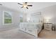 Bright and airy bedroom with neutral tones features a large bed, side tables, and ample natural light at 10200 Windalier Way, Roswell, GA 30076
