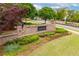 Attractive brick entrance with lush landscaping creates a welcoming gateway to the Harlow community at 10200 Windalier Way, Roswell, GA 30076